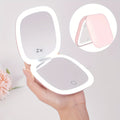 Handheld Mirror with LED Lights, Featuring a Double-Sided Design, Three Brightness Settings, USB Rechargeable Capability, And a Foldable, Portable Structure, Ideal for Makeup Application And Travel, Including Regular And 2X Magnification Options.